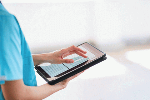 Shot of a doctor showing a patient some information on a digital tablet